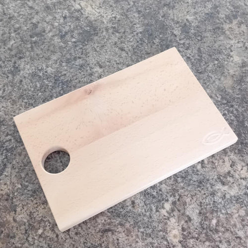 wooden chopping board with christian fish