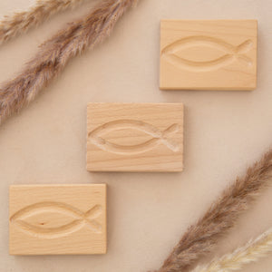 wooden handheld prayer fish