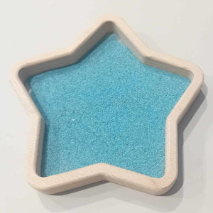 blue coloured play sand and star sensory play tray