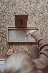 number flashcards with sand writing tray