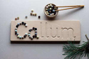 Wooden name board with felt balls The little coach house