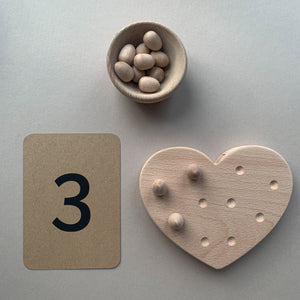 Heart fine motor board with number flashcards and loose parts wooden eggs